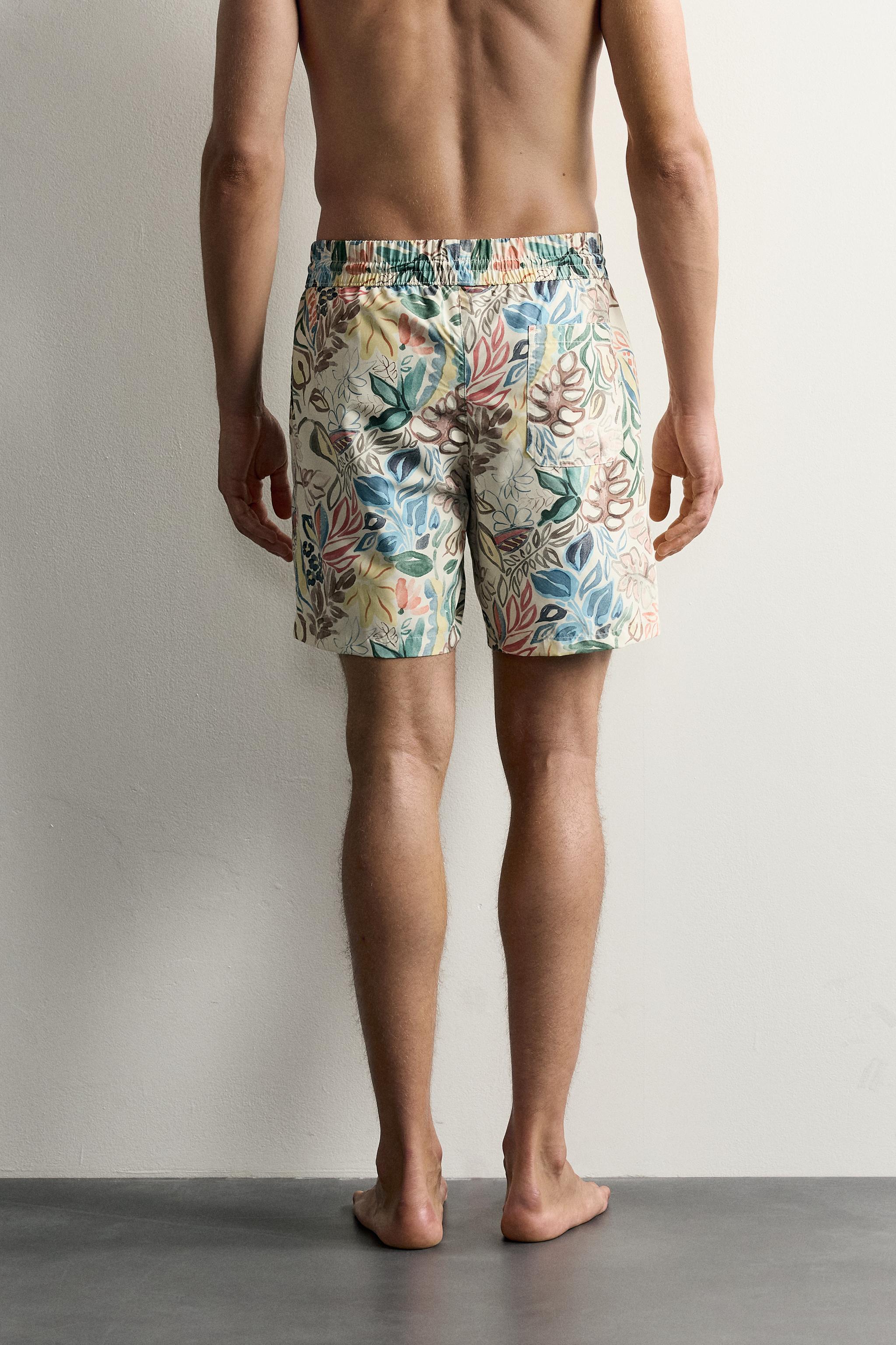 LONG FLORAL PRINT SWIM TRUNKS